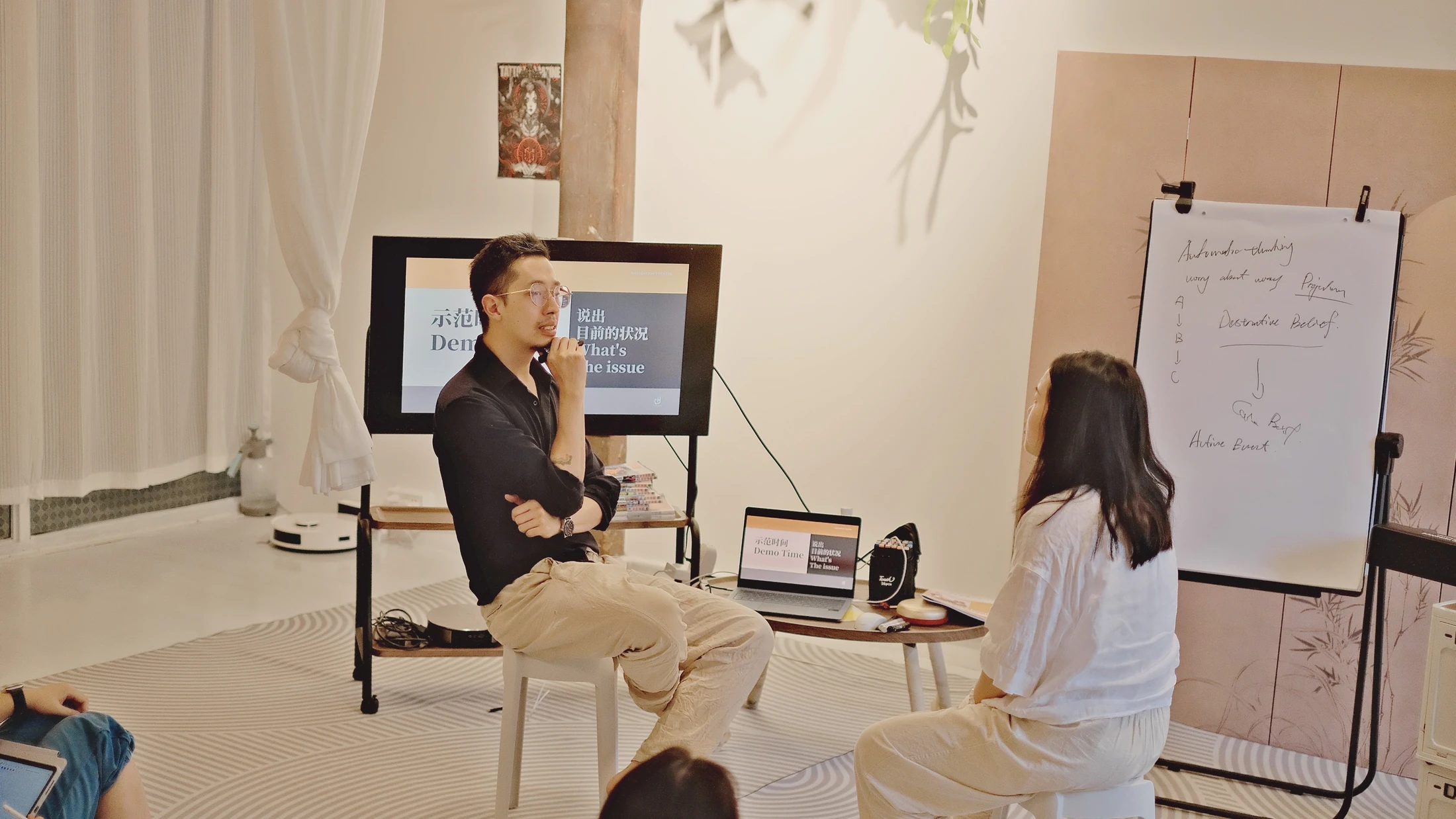 A facilitator leading a live therapeutic practice demonstration